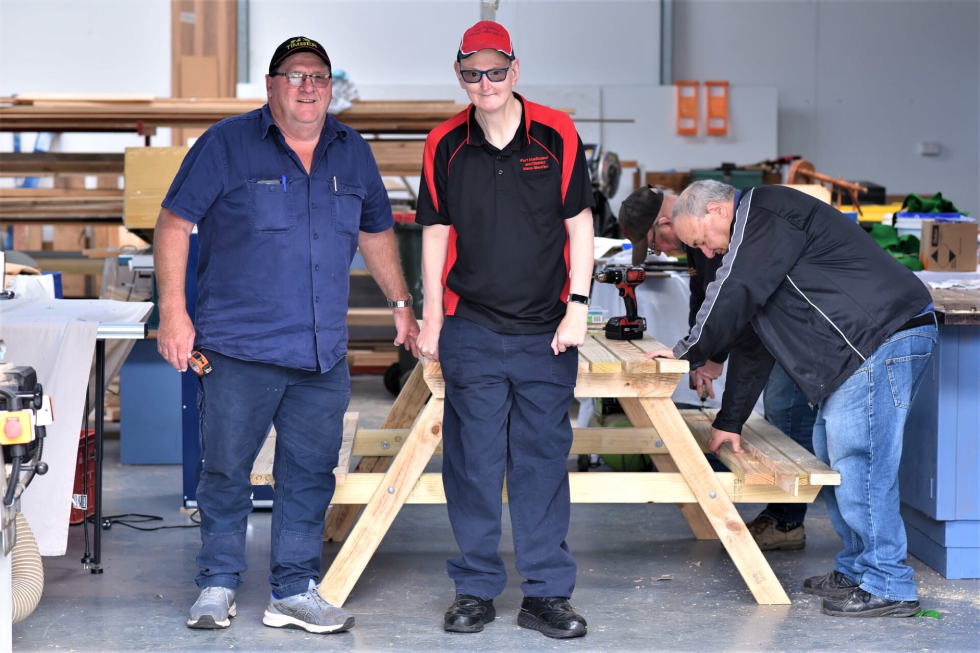 Ashley is pictured with Support Worker Bruce (left) at the Port MacDonnell Men’s Shed, working on an outdoor setting for local school, Allendale East Area School.